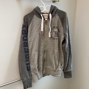 SuperDry zip-up hoodie, “British design.”